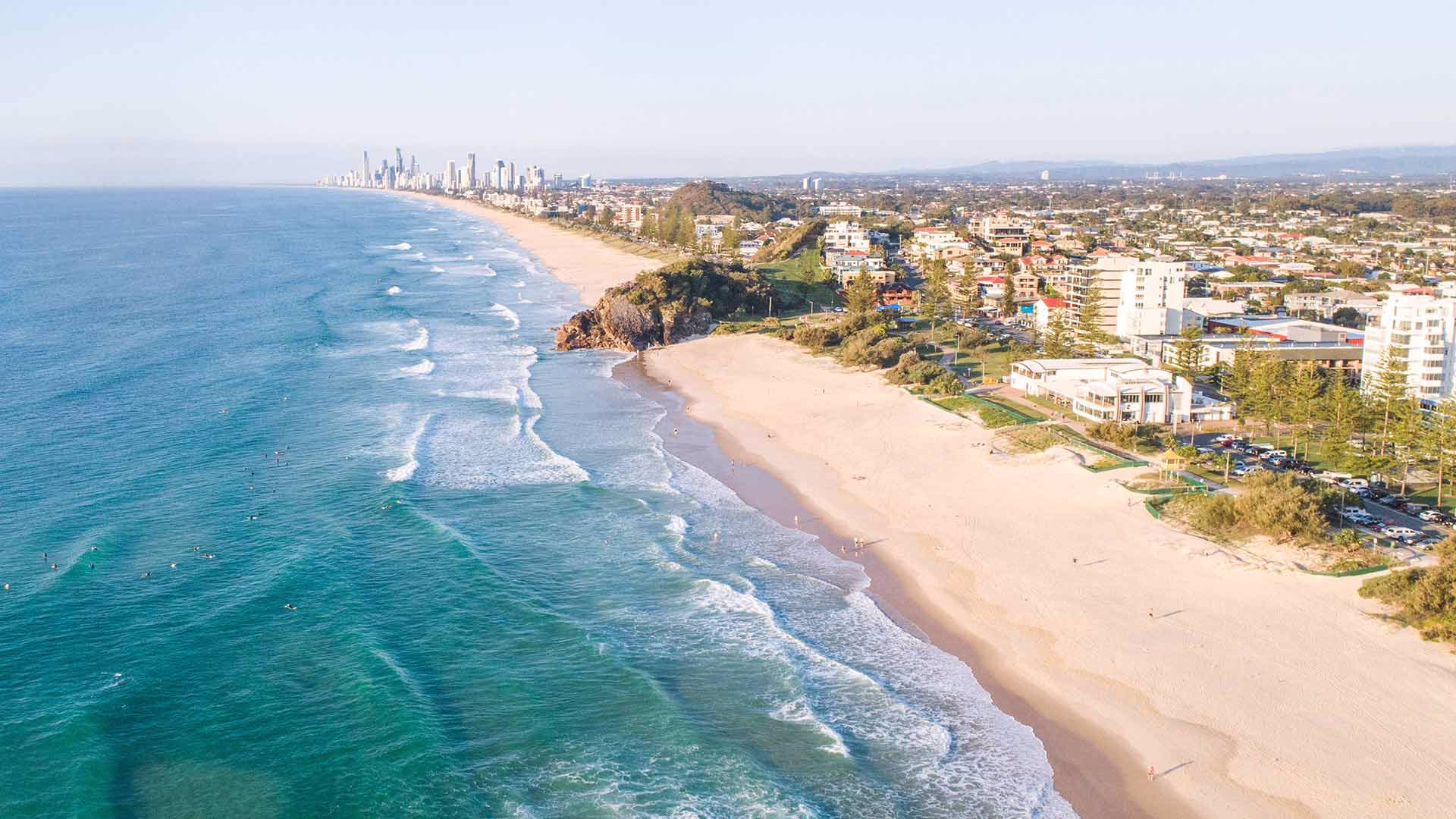 Gold Coast beaches stretching along the coastline, showing the range of surf breaks for learners