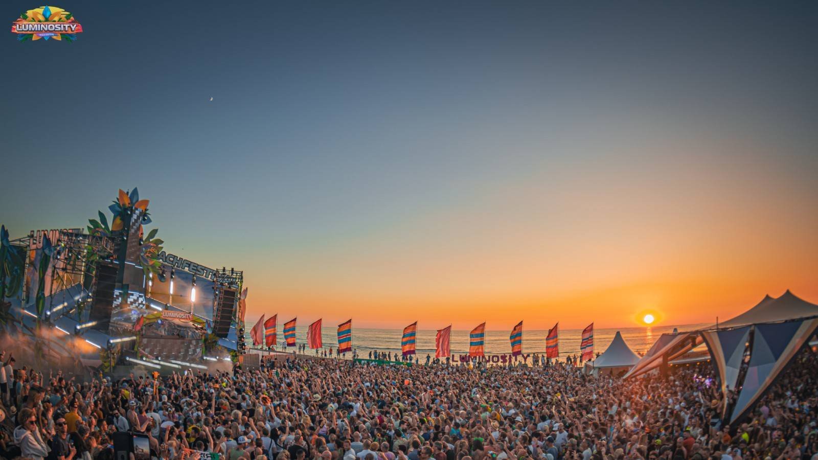 Crowds at a Gold Coast beachfront festival at dusk